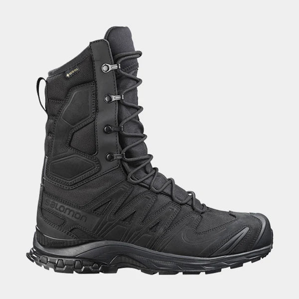 A detailed close-up of the right side of the Salomon XA Forces 8 GTX tactical boot, displaying the durable nubuck leather upper, reinforced closed lace hooks, and the protective medial pad.