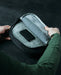 the image showcases the eberlestock ade flex micro in the color black and is showcasing the product's velcro-in pistol retainer in one of its pockets that will secure the user's pistols 