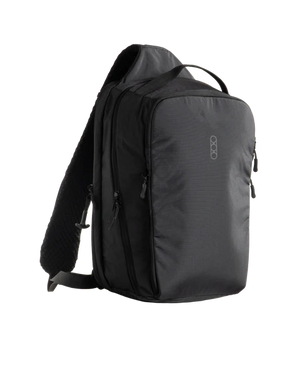Eberlestock Fade Sling XL in black, front three-quarter view showing the padded shoulder strap, top carry handle, and multiple zippered front pockets.
