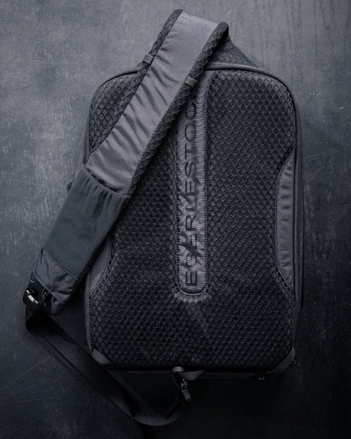 Close-up of the Eberlestock Fade Sling XL's padded mesh back panel and shoulder strap, showing the breathable material and adjustable strap hardware.