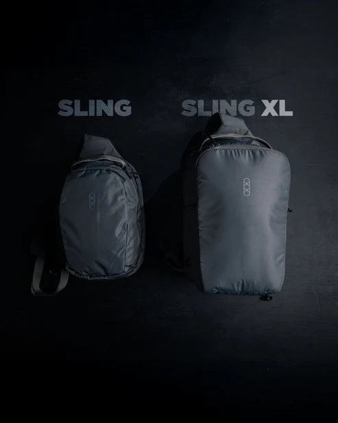 Side-by-side size comparison of the standard Eberlestock Fade Sling and the larger Eberlestock Fade Sling XL, showing the added height and bulk of the XL model.