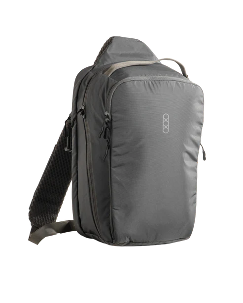 Eberlestock Fade Sling XL in steel gray, front three-quarter view showing the top carry handle, front zippered pockets, and padded shoulder strap.