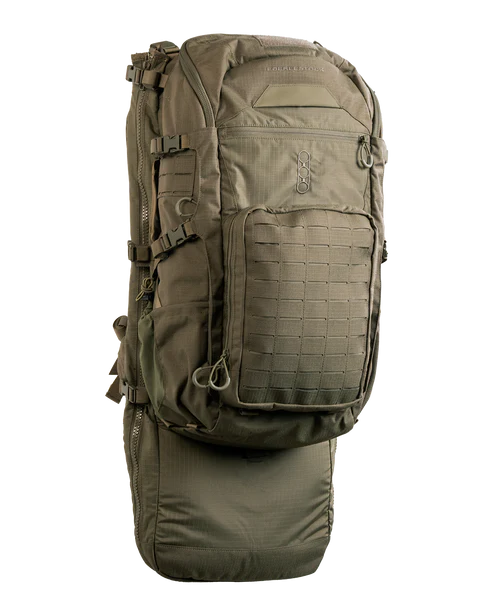 A high-resolution frontal shot of the Eberlestock Spectre Military Backpack in military green, showcasing the rugged exterior and modular attachment points for tactical gear.