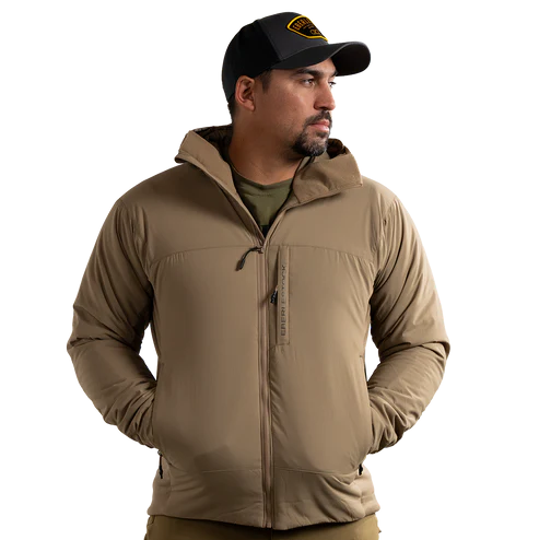 Front view of the Eberlestock Alturas Hooded Jacket in Dry Earth worn by a Mexican model.