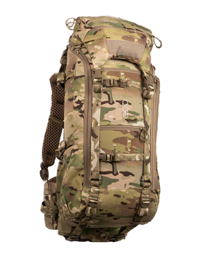 A frontal angled view of the Eberlestock Brute 3500 Multi-Day Hunting Pack in Multicam, showing how the specialized camo pattern blends into the environment while highlighting the rugged storage compartments.