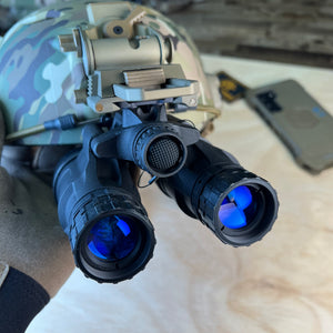A frontal angled perspective shows the nocturn industries katana securely attached to a Team Wendy Exfil SL helmet, with the white phosphor lens assemblies, power control, and battery compartment cap prominently displayed in the foreground.