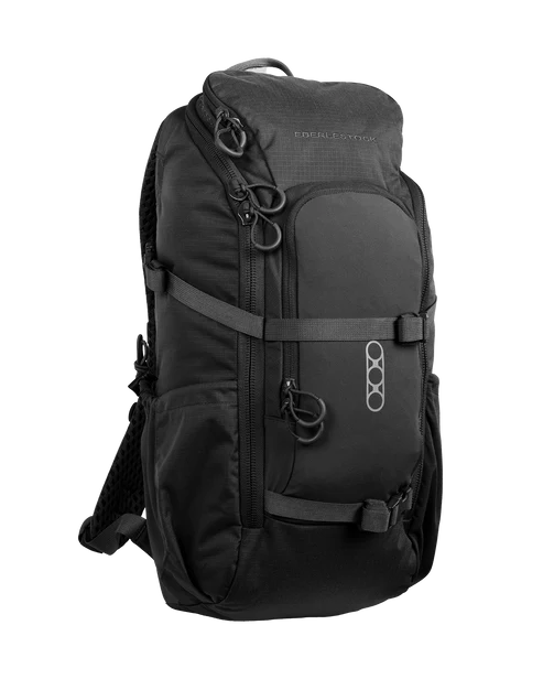 A frontal right-angled view of the Eberlestock Brute Scout 30L Hunting Pack in Black, featuring the industrial-grade 500D nylon construction and the sleek, low-profile design that allows for silent and fast-paced movement through the backcountry.