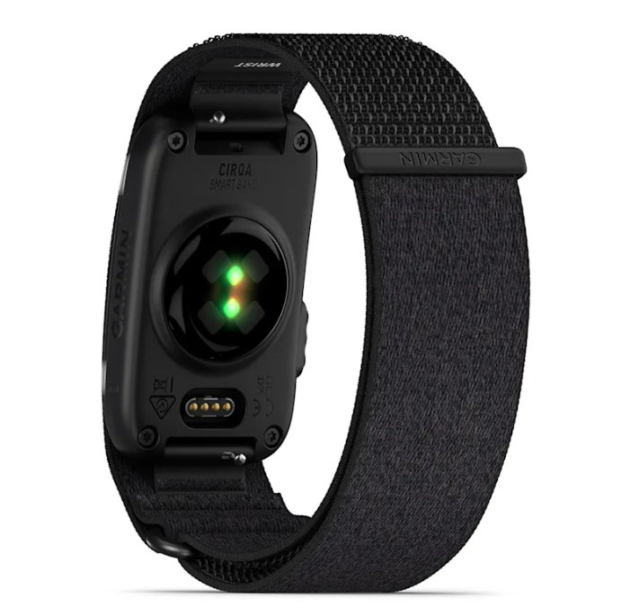 the garmin cirqa smart band in variant black showcasing the sensor part of the screenless watch and teh cahrging port