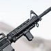 A side profile of a customized rifle featuring a secondary handgun attached to the lower section of the Strike M4 Hand guard, showing a vertical grip securely mounted to the bottom Picatinny rail for improved stability.