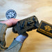 the holosun industries iris gr 3 being help up by a product model to showcase the sight options and its knob controls