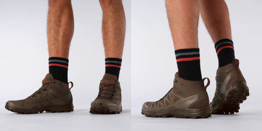 A horizontal wide shot of a model equipped with the Earth Brown salomon speed assault 2 boots, displaying how the tactical footwear blends into arid terrain while providing ankle support and speed.