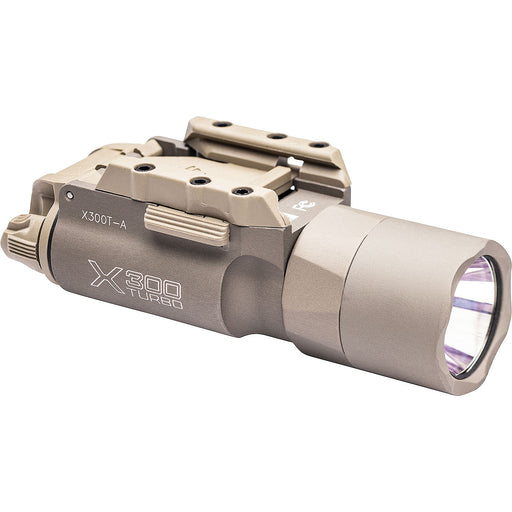 A left-angled frontal view of the tan SureFire X300 Turbo (B-Model), displaying the secure T-slot thumbscrew and deep reflector bezel