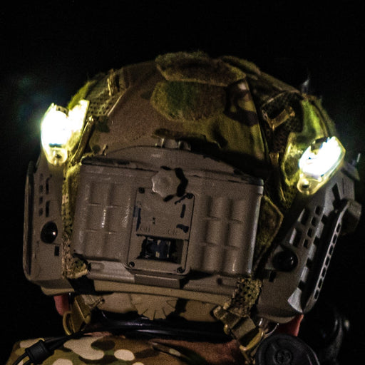 lit pair of core survival hel-star rail strobe mounted to helmet