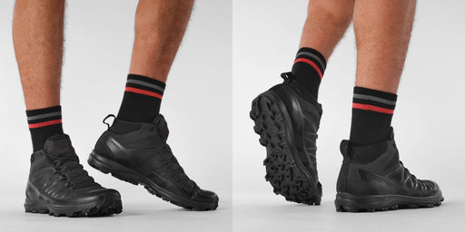 A horizontal lifestyle image of a model wearing the black salomon forces speed assault 2, demonstrating the lightweight tactical design and agility required for operational use.