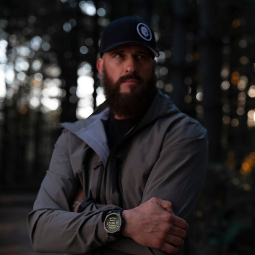 model showing the garmin tactix 8 51 mm solar on his right wrist displaying the track me feature