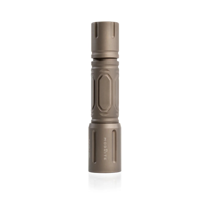 an image of the product where the item is a vertically placed and is in the color FDE standing on its top against a seamless pure white background. The hexagonal pattern and contours of the textured body are clearly visible, and with the bezel head features the vertically engraved white text 'modlite' is printed on it.