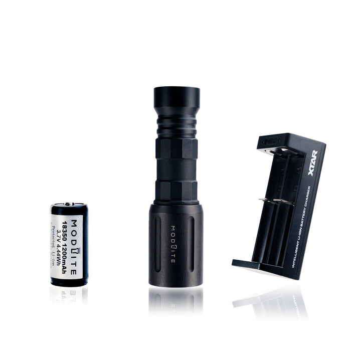 an image of the modlite plhv3 18350 rifle light package in the color black showcasing the complete package option which includes the flashlight body, light head, tailcap, charger and the 18650 battery, and the image shows three items where the black flashlight is in the middle, the charger on its left and the battery on its right.