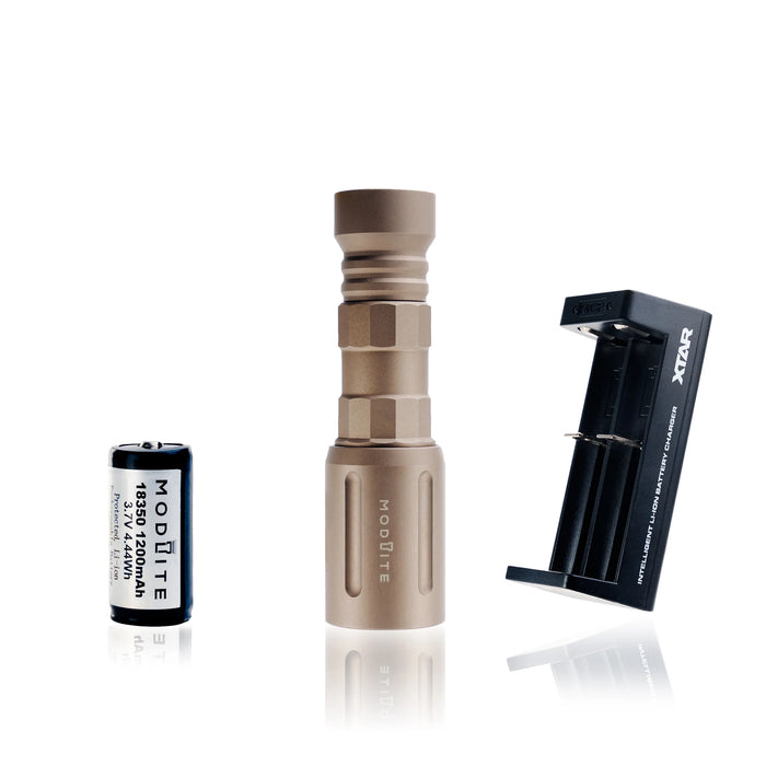 an image of the modlite plhv3 18350 rifle light in the color fde that shows the complete package option which includes the light body, light head, tailcap, charger and the 18350 battery, and the image shows three items where the black flashlight is in the middle, the charger on its left and the battery on its right.