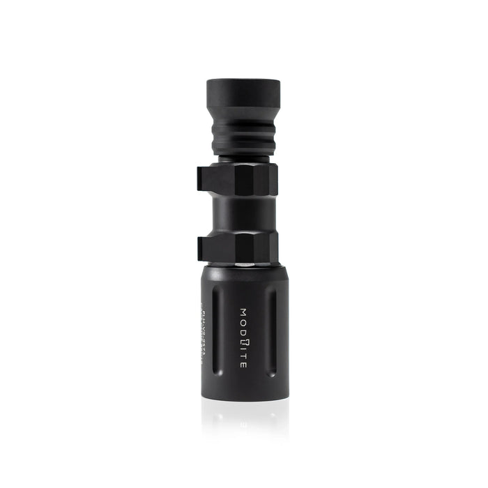 an image of the product where the item is a vertically placed, matte black Modlite PLHv3 18350 rifle light with rifle attachments placed on the flashlight body, standing on its light head against a pure white background. The hexagonal pattern and contours of the textured body are clearly visible, and with the bezel head features the vertically engraved white text 'modlite' branded on it.