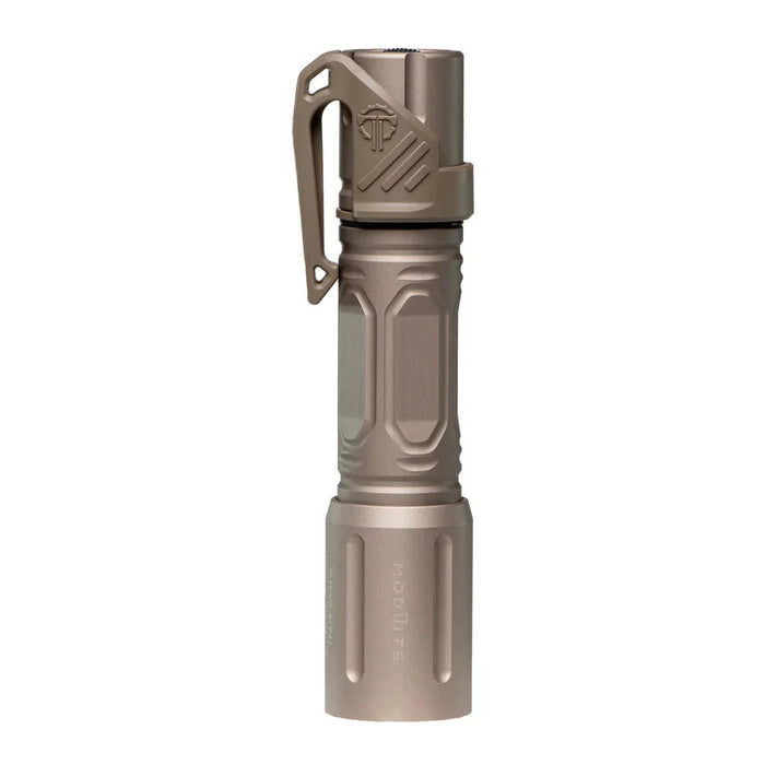 An image of the modlite multi-mode handheld plhv3 18650 flashlight showcasing the item in the color FDE placed in the middle of the photo and with a textured grip and white product lettering detailing its dual fuel, multi-mode capabilities on a reflective surface and with the thyrm low profile clip attached to it.
