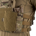 A close-up side view of an operator wearing a tactical vest equipped with the MultiCam LPV Side Radio Pouch. The pouch securely holds a brown rifle magazine, demonstrating how the adjustable bottom attachments enhance retention during active movement.