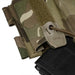 A detailed close-up of the MultiCam magazine pouch, highlighting the rigid re-indexing tab and the secure Shock cord routed through a metal eyelet to firmly hold a black rifle magazine in place.