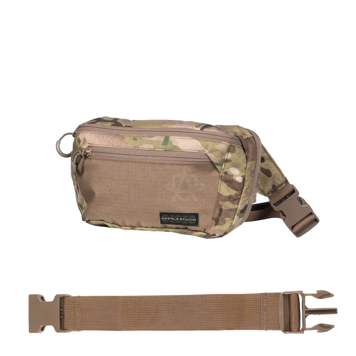 A side-angled view of the Multicam pack connected to a Dry Earth eberlestock bando bag extension strap, showing the adjustable setup that accommodates larger chest measurements.