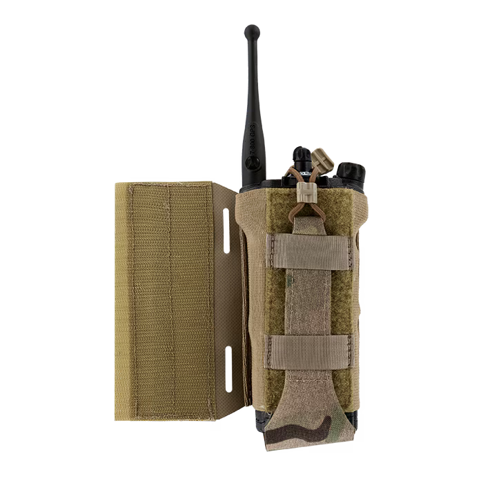 A detailed view of the MultiCam tactical radio pouch fully loaded with a black communication radio. The extended side panel highlights the precision laser-cut slots and the strong hook-and-loop backing used for secure, customizable attachment to plate carriers.