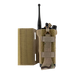 A detailed view of the MultiCam tactical radio pouch fully loaded with a black communication radio. The extended side panel highlights the precision laser-cut slots and the strong hook-and-loop backing used for secure, customizable attachment to plate carriers.