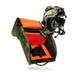 An open Multicam Tropic camouflage gear bag displaying its bright orange interior and central divider, answering the question of is V2 OG Tactical Helmet Bag w/ Nods Box a good storage by showing a fully equipped tactical helmet hovering right above it ready to be packed