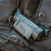 nocpix lumi l35 rests on top of a black backpack