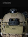 the image shows a product model wearing a ranger green or sage team ops-core helmet that has the nocturn industries mini bat pack in the black version that is attached on the helmet using the velcro backing of the battery pack and secured with the bungee/shock cored through the built in retention loops and is anchored to the helmet's rear ARC rail slots.