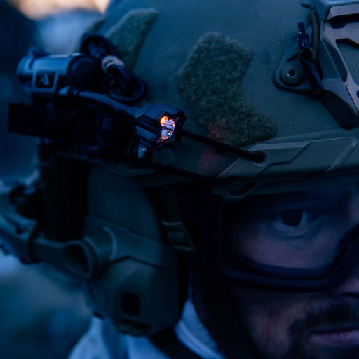 operator wears helmet with charge x with red led turned on