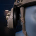 A close-up studio shot of a mannequin wearing the headset, featuring the Ops-Core AMP Helmet Rail Mount Kit with Vent Mode popped outward to demonstrate the airflow gap created between the ear and the cushion.