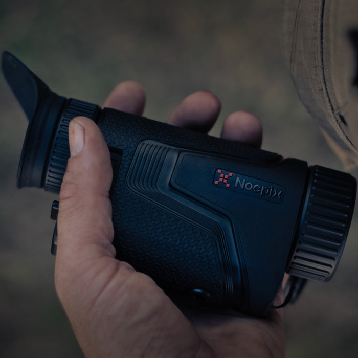 person’s hand is holding a black nocpix lumi l35 thermal monocular gallery