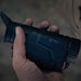 person’s hand is holding a black nocpix lumi l35 thermal monocular gallery