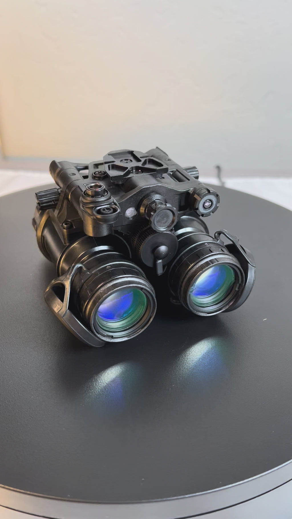 A comprehensive 360-degree video showcase of the pvs-31d night vision binoculars by Atomic Defense, featuring the lightweight articulating housing with both lens covers removed to reveal the Gen 3 white phosphor thin-filmed tubes.
