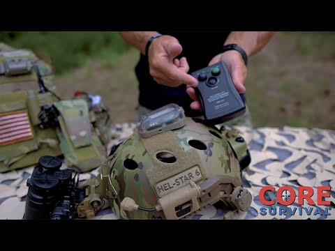 A YouTube video thumbnail showing a tactical gear expert holding the black programming module during a comprehensive HEL-STAR 6 GEN III+ & HEL-STAR F2 Review, demonstrating how to wirelessly sync the helmet beacons.
