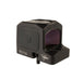 a back isometric product photo of the Trijicon RCR Red Dot Sight against a plain white background and prominently featured at the front-left, reflecting a dramatic green and orange dichroic coating and showing small white laser-engraved markings are visible along the base on the right side and the small Trijicon 'Tri' triangle logo above it.