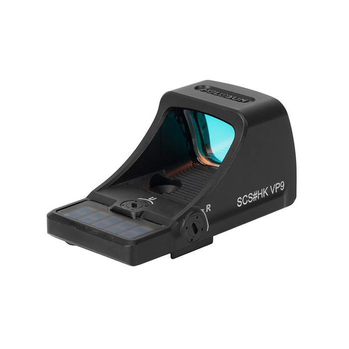 A right-angled isometric view of the SCS-VP9-GR open reflex sight, showing the laser-engraved factory model part number on the rugged housing and the precise windage adjustment controls located on the side.