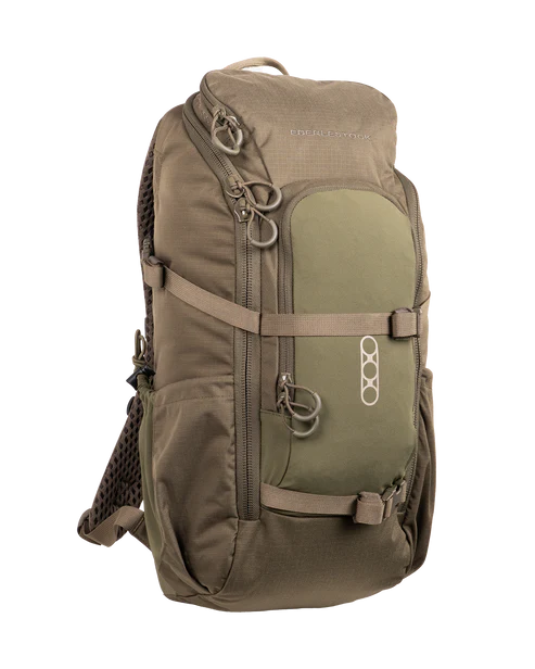 A right-angled profile view of the Eberlestock Brute Scout Hunting Pack in Military Green, highlighting its streamlined depth and the internal aluminum stay that provides heavy-duty support without the bulk of an external frame.