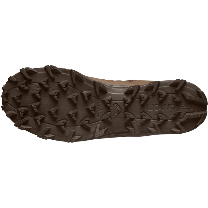 A direct view of the outsole on the Earth Brown salomon speed assault boot, clearly displaying the deep chevron lugs that ensure reliable traction on loose and uneven surfaces.