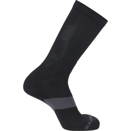 A side profile view of the Salomon XA Forces Crew Socks in black, showcasing the anatomical fit, reinforced heel, and ribbed calf support designed for tactical operations.