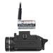 A side profile shot showing the Streamlight TLR-3X weapon light with the SL-B9 rechargeable battery removed and connected to a USB cable for charging.