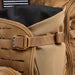 
Zoomed-in view of the Siege 35L Pack in Coyote Brown, showing the expandable front pocket fully extended to provide extra carry capacity for bulky mission gear like helmets or jackets.