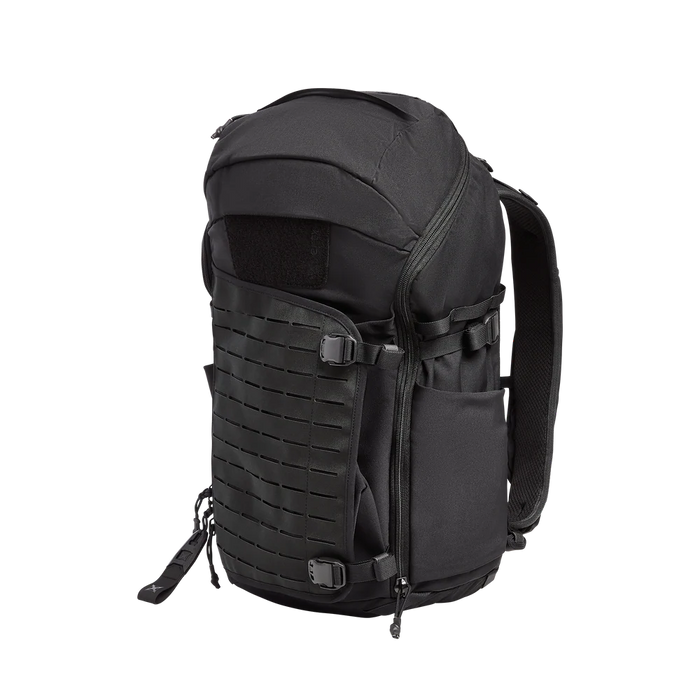 Side-angled view of the Siege 35L Pack in It's Black, featuring expandable side pockets and compression straps for securing gear
