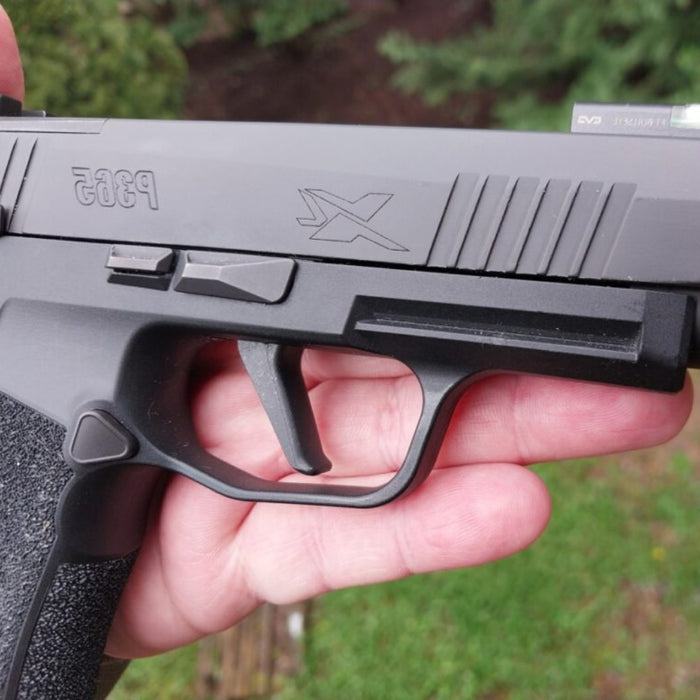 The flat trigger mod installed on a P365  firearm