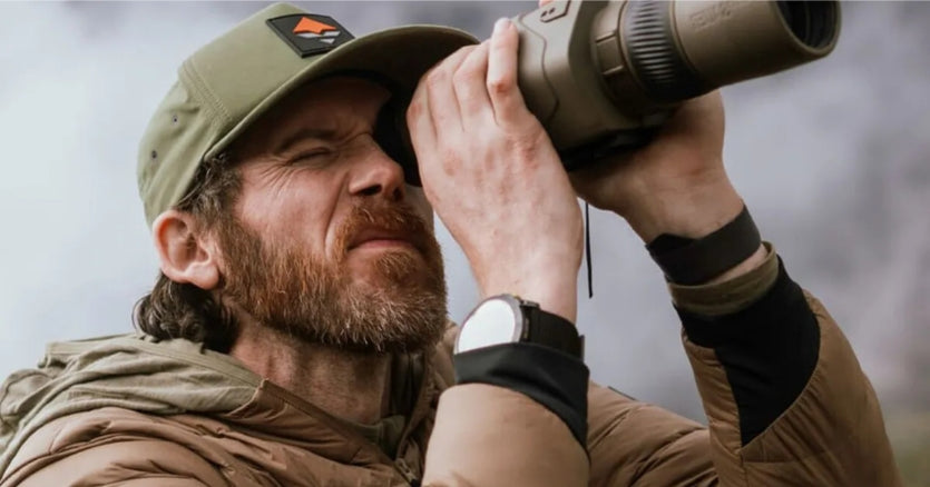 Someone looking through the Sig OSCAR6 HDX Pro