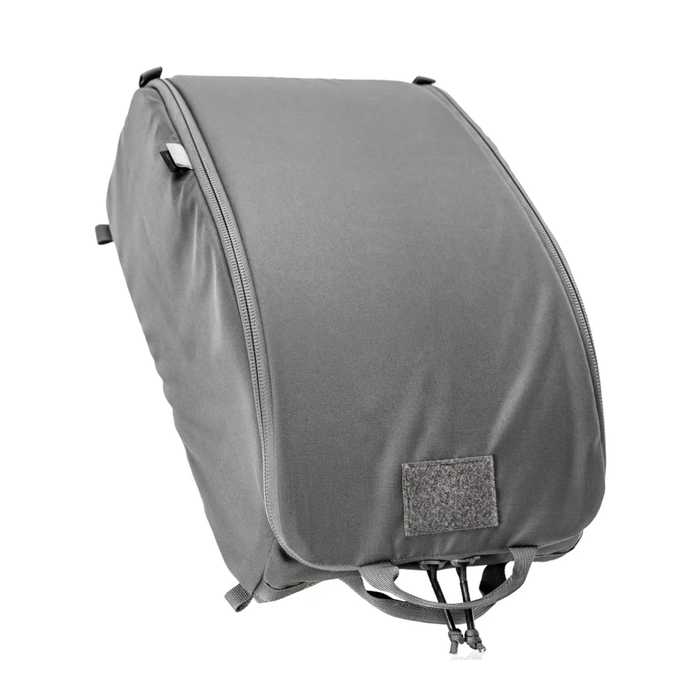 A sleek, solid wolf grey padded helmet bag shown fully closed and standing upright, featuring a durable continuous front zipper, a blank velcro loop panel, and bottom grab straps for easy transport.