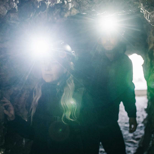couple-exploring-cave-wearing-surefire-minimus-variable-output-led-headlamp